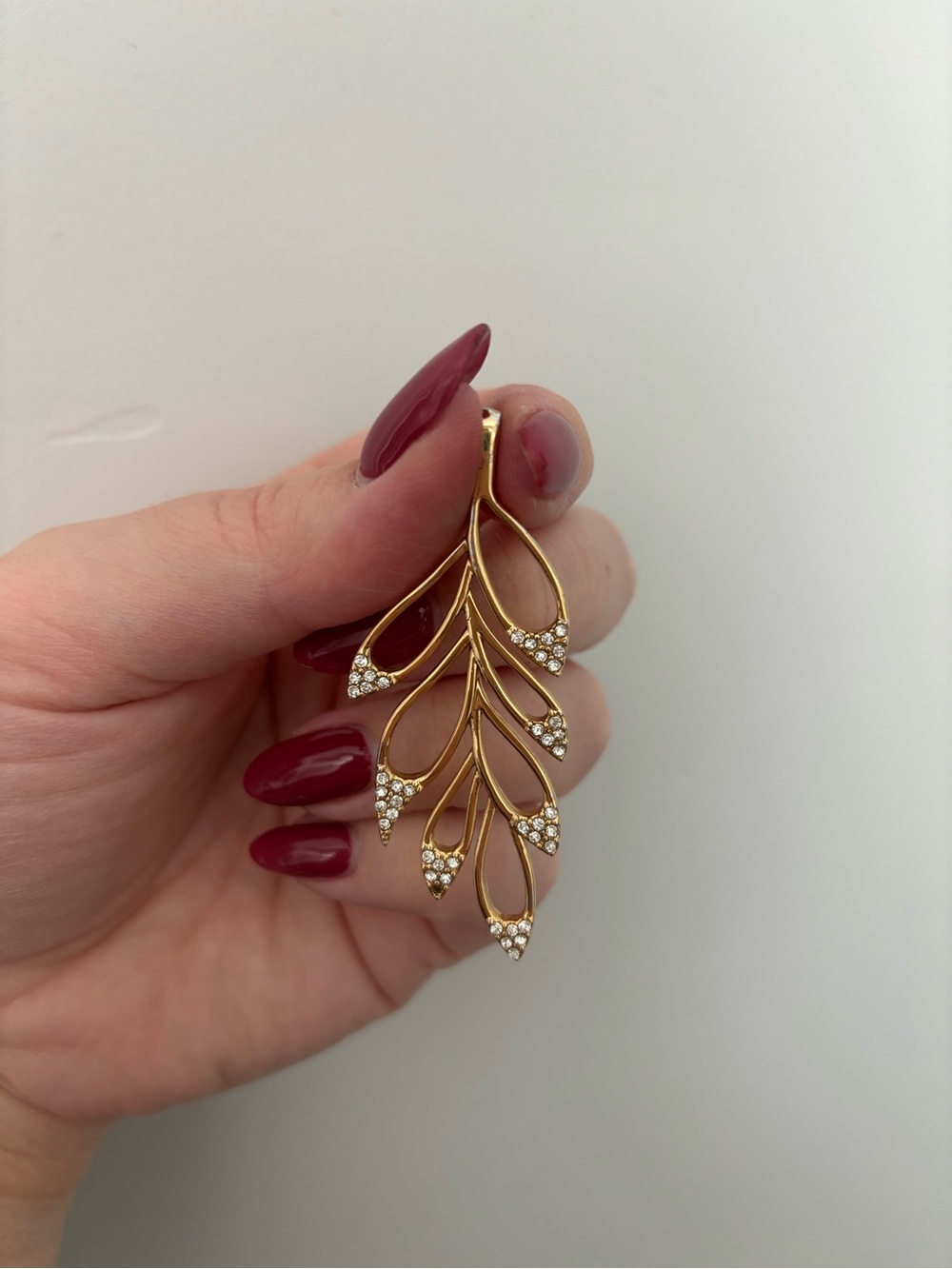Elegant Gold Leaf Pendant with Crystal Accents